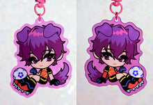 Load image into Gallery viewer, Anime character chibi keychain with maroon hair in light magenta border with soccer ball.