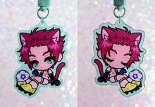 Load image into Gallery viewer, Anime character chibi keychain with red hair in light green border with soccer ball.