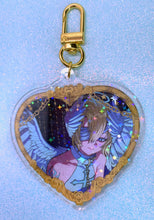 Load image into Gallery viewer, Heart-shaped keychain with anime character design on a light blue background